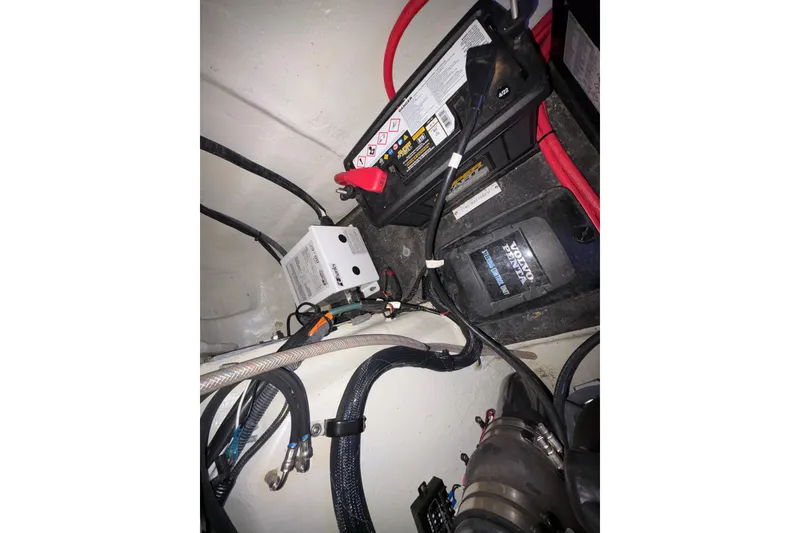 Slide: The Image of Engine compartment of a 2017 Cobalt R35 with battery and wiring components. - 36