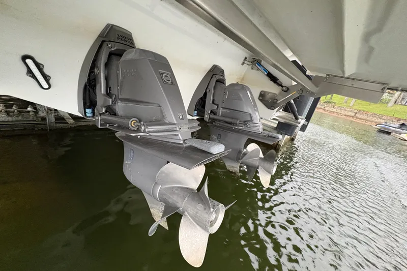 Slide: The Image of Dual Volvo Penta outdrives on a 2017 Cobalt R35 boat in water. - 44