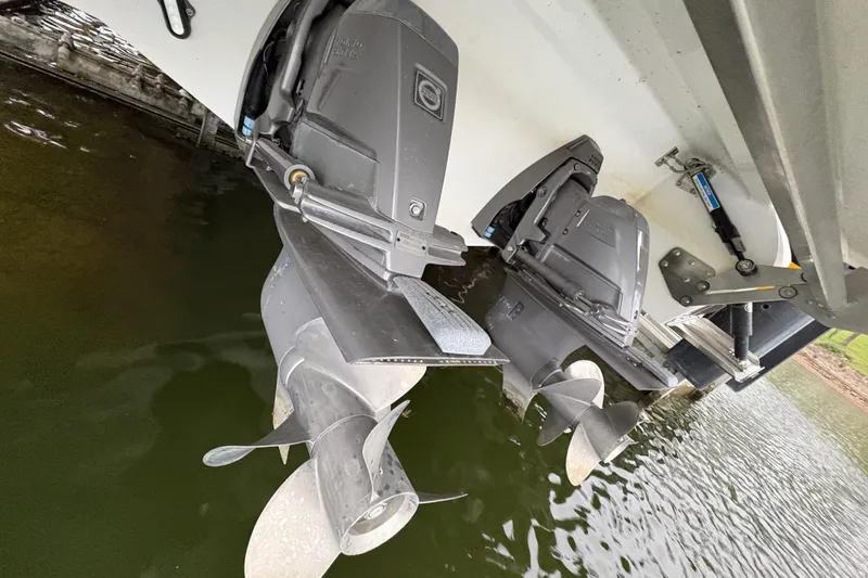 Slide: The Image of 2017 Cobalt R35 boat propellers submerged in water, showcasing dual outboard motors. - 45