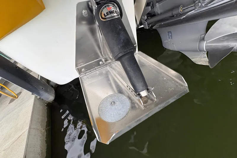 Slide: The Image of Trim tab of a 2017 Cobalt R35 boat with Lenco actuator in water. - 46