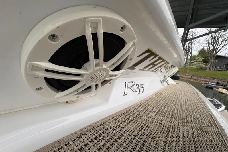 Slide: The Image of 2017 Cobalt R35 boat with speaker and dock view. - 47