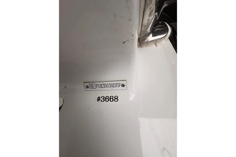 Slide: The Image of Hull identification number on 2017 Cobalt R35 boat, displaying US-FGE35030D717. - 51