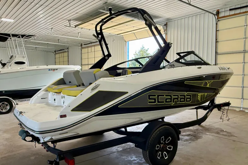 Slide: The Image of 2023 Scarab 195 ID boat interior with modern seating and sleek design. - 11