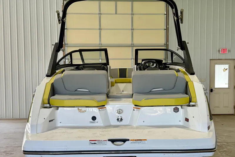 Slide: The Image of 2023 Scarab 195 ID boat interior with yellow seating and modern dashboard. - 13