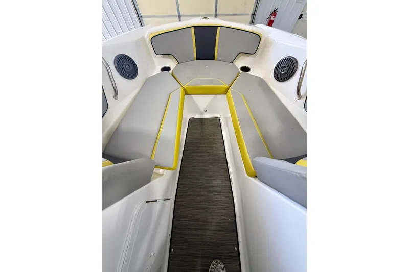 Slide: The Image of Interior of 2023 Scarab 195 ID boat with gray and yellow seating. - 15