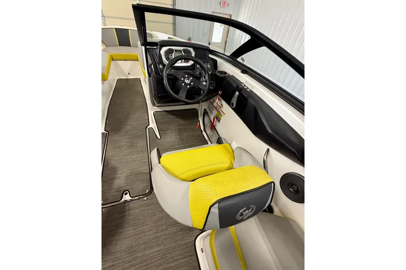 Slide: The Image of 2023 Scarab 195 ID boat in a garage, showcasing sleek design and modern features. - 7