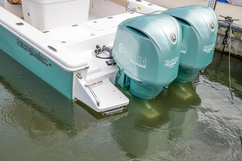 Slide: The Image of Manufacturer Provided Image: 2026 Everglades 273 Center Console with twin Yamaha 300 engines in water. - 12
