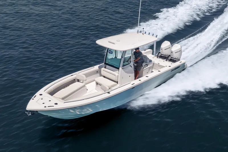 The Image of 2026 Everglades 273 Center Console boat cruising on open water. - 0