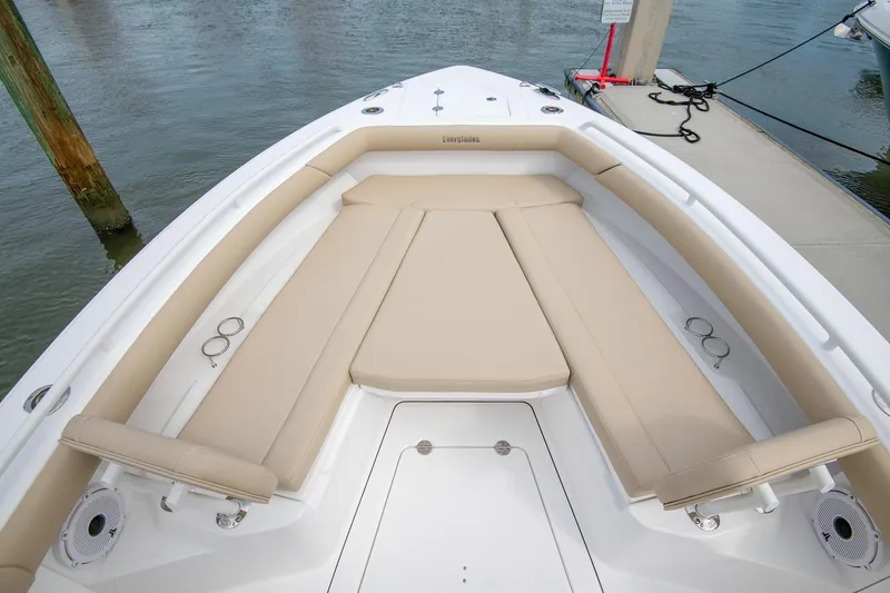 Slide: The Image of Manufacturer Provided Image: Bow seating area of 2026 Everglades 273 Center Console boat, featuring beige cushions. - 3