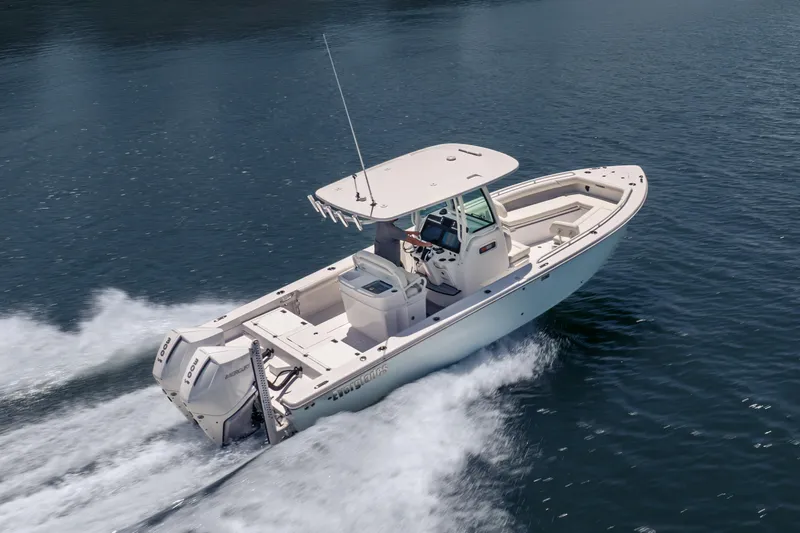 Slide: The Image of 2026 Everglades 273 Center Console boat cruising on open water. - 3