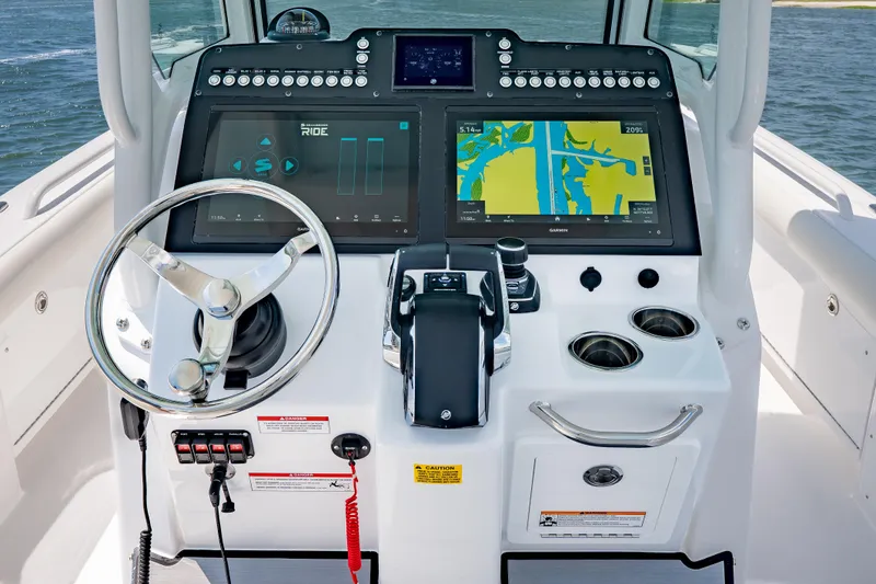 Slide: The Image of Center console of 2026 Everglades 273 boat with advanced navigation displays. - 14