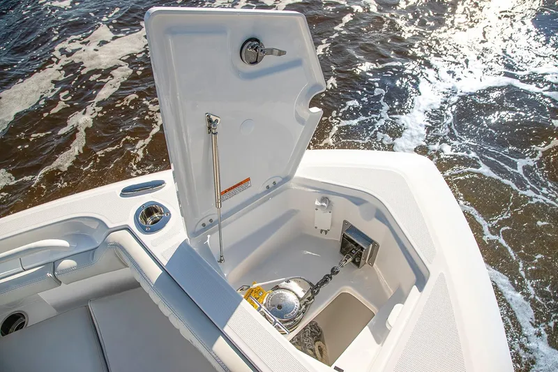 Slide: The Image of Manufacturer Provided Image: 2026 Everglades 273 Center Console boat anchor compartment with ocean background. - 4