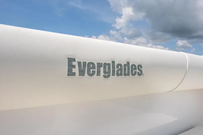Slide: The Image of Everglades 273 Center Console 2026 boat logo against blue sky background. - 24