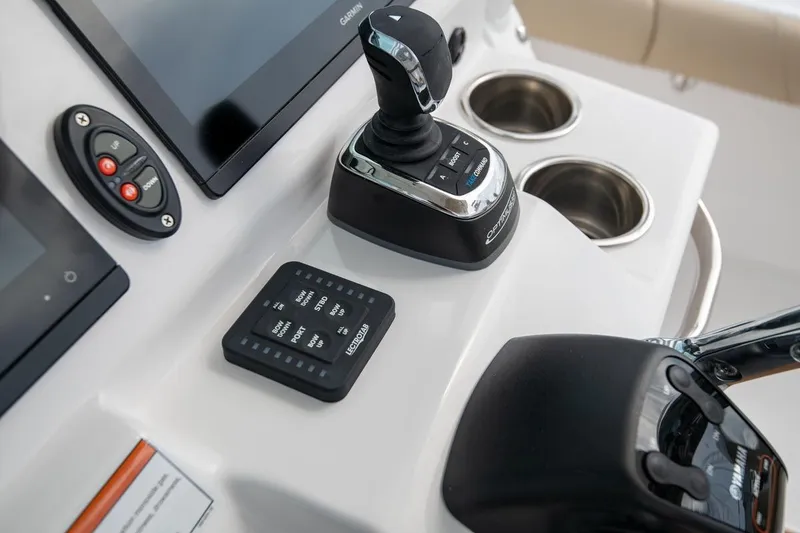 Slide: The Image of Control panel of 2026 Everglades 273 Center Console boat with joystick and displays. - 7