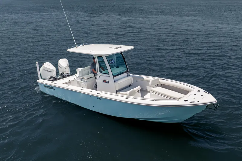 Slide: The Image of 2026 Everglades 273 Center Console boat on open water, featuring dual Mercury engines. - 1