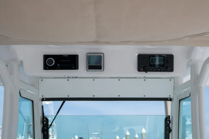 Slide: The Image of 2026 Everglades 273 Center Console dashboard with modern navigation and audio systems. - 9