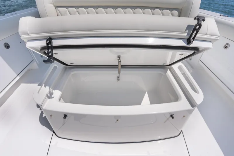 Slide: The Image of Open storage compartment on 2026 Everglades 273 Center Console boat, showcasing spacious interior. - 18