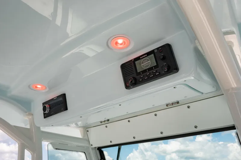 Slide: The Image of Interior view of 2026 Everglades 273 Center Console boat with modern control panel. - 15
