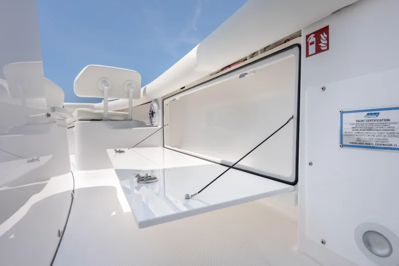 Slide: The Image of 2026 Everglades 273 Center Console boat interior with open storage compartment. - 19