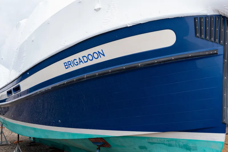 Slide: The Image of 2002 Nordic Tug 32 boat named Brigadoon, covered and docked. - 13