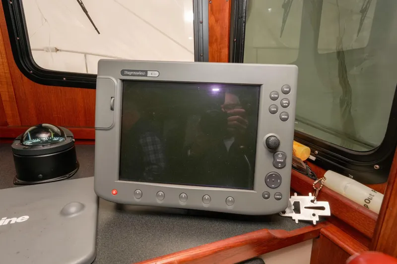 Slide: The Image of Raymarine C120 navigation system on 2002 Nordic Tug 32 boat dashboard. - 4