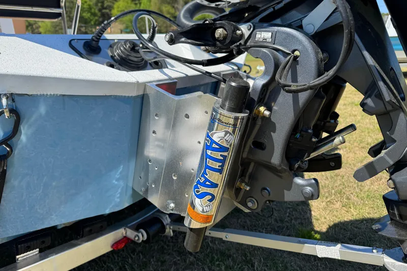 Slide: The Image of 2026 Xpress XR21 Bay boat with Atlas hydraulic jack plate, detailed view. - 11