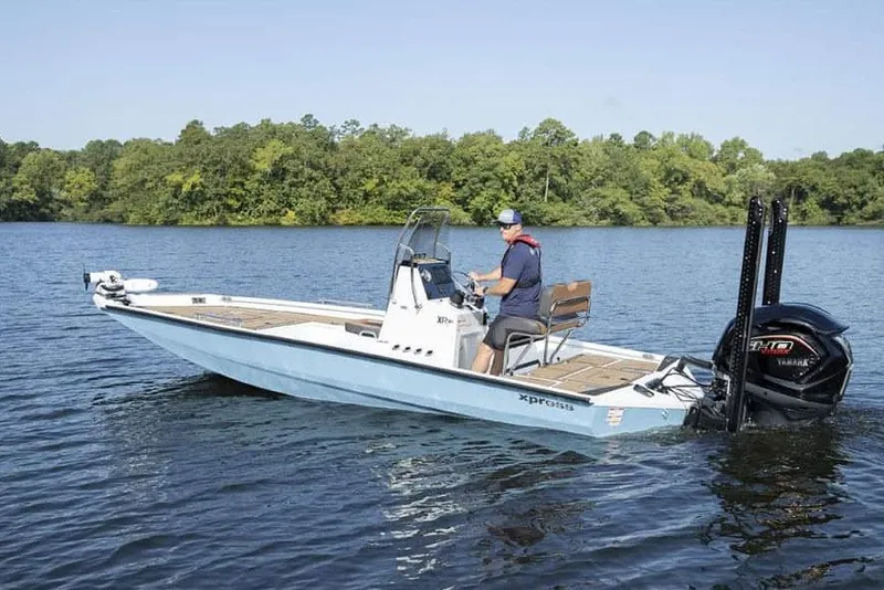 Slide: The Image of Manufacturer Provided Image: 2026 Xpress XR21B Bay boat on a lake with a Yamaha outboard motor. - 16