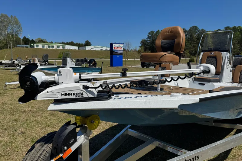 Slide: The Image of 2026 Xpress XR21 Bay boat with Minn Kota Terrova motor on display outdoors. - 3