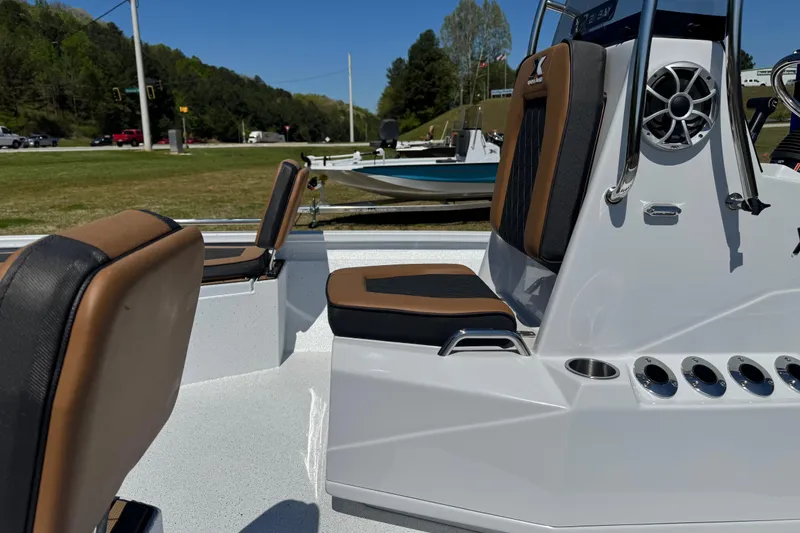 Slide: The Image of 2026 Xpress XR21 Bay boat interior with cushioned seating and sleek design. - 6