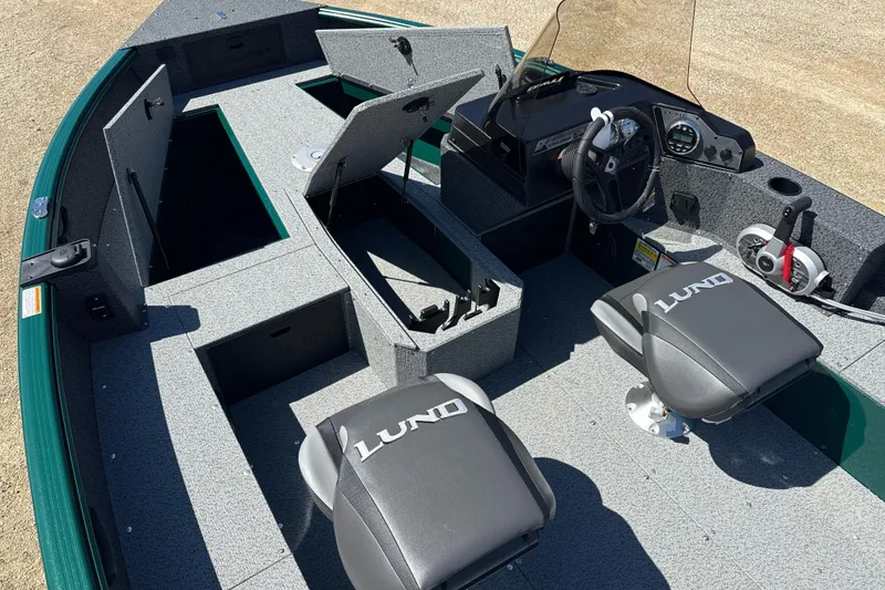 Slide: The Image of 2026 Lund 1700 Explorer SS boat interior with storage compartments and seating. - 5
