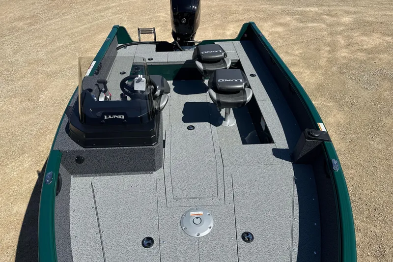 Slide: The Image of 2026 Lund 1700 Explorer SS boat interior with seating and steering console. - 6