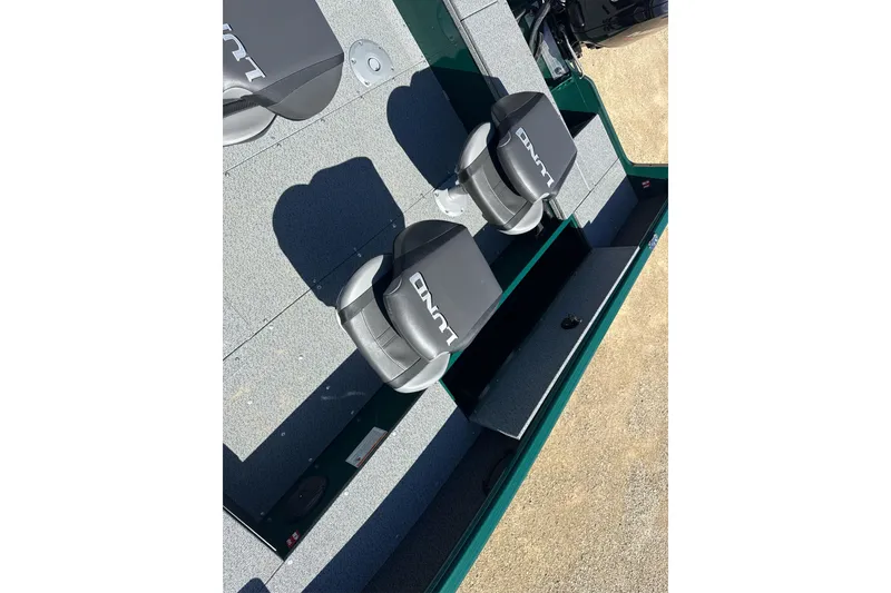 Slide: The Image of 2026 Lund 1700 Explorer SS boat interior with gray seating and storage compartments. - 7