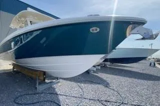 Slide: The Image of 2019 Everglades 335 Center Console boat displayed outdoors on gravel. - 3
