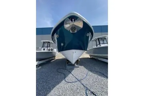 Slide: The Image of 2019 Everglades 335 Center Console boat interior with helm, steering wheel, and ocean view. - 9