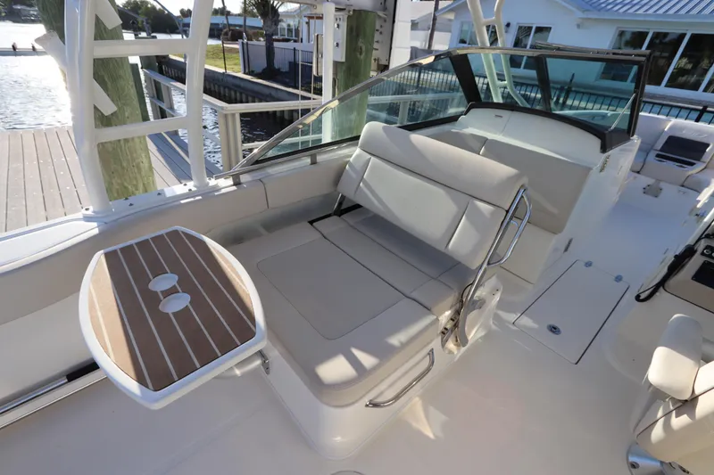 Slide: The Image of 2016 Boston Whaler 270 Vantage boat interior with seating and table. - 15