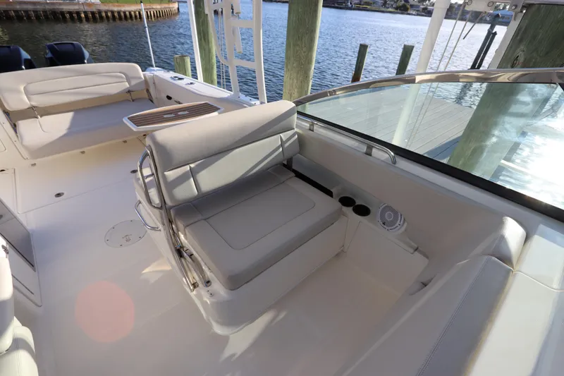 Slide: The Image of 2016 Boston Whaler 270 Vantage boat interior with seating and water view. - 17