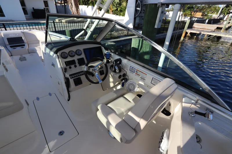 Slide: The Image of 2016 Boston Whaler 270 Vantage boat cockpit with steering wheel and control panel. - 22