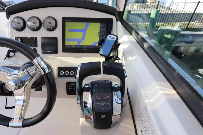 Slide: The Image of 2016 Boston Whaler 270 Vantage helm with Garmin navigation and control panel. - 24