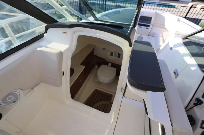 Slide: The Image of 2016 Boston Whaler 270 Vantage boat interior with cabin and seating area. - 26