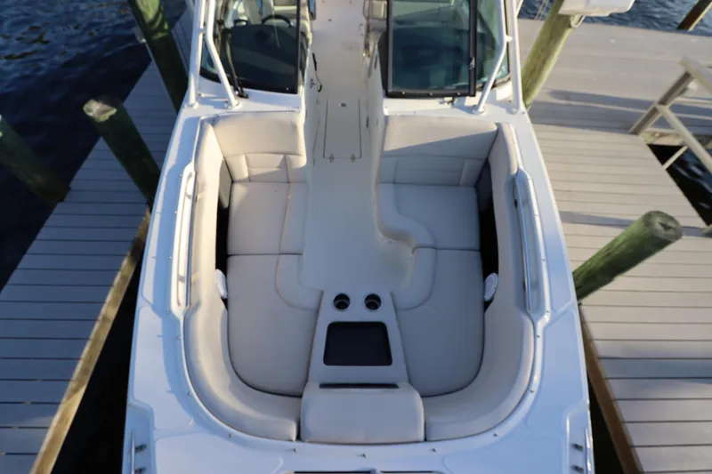 Slide: The Image of 2016 Boston Whaler 270 Vantage boat docked, featuring spacious seating and sleek design. - 32