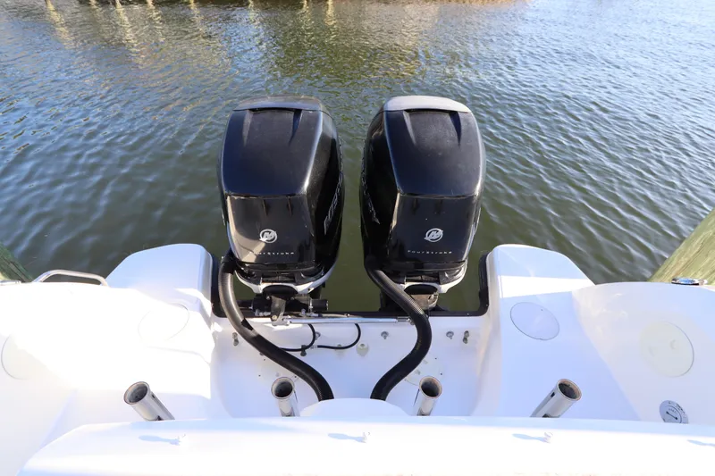 Slide: The Image of 2016 Boston Whaler 270 Vantage with dual outboard engines on water. - 4