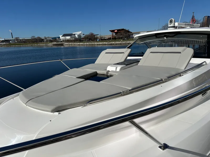 Slide: The Image of 2024 Pursuit OS405 yacht with luxurious sun loungers on deck. - 1