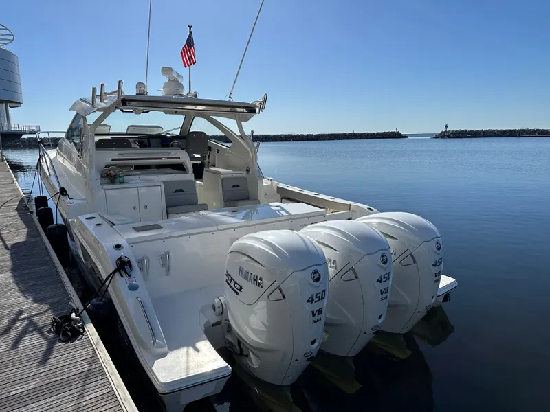 Slide: The Image of 2024 Pursuit OS405 boat with three Yamaha 450 V8 engines at dock. - 5