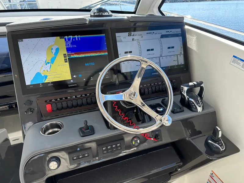 Slide: The Image of Pursuit OS405 boat helm, 2024 model, featuring advanced navigation systems. - 6