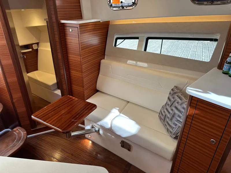 Slide: The Image of Interior of 2024 Pursuit OS405 yacht with elegant wood paneling. - 9