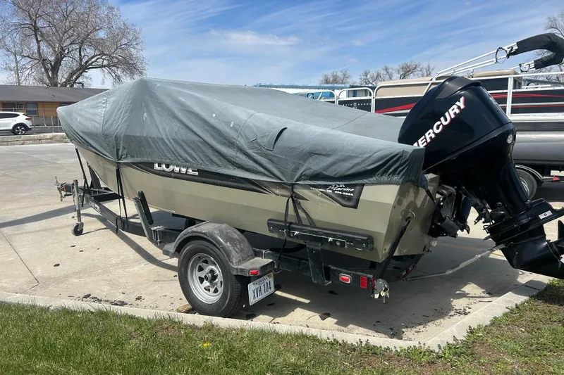 Slide: The Image of 2006 Lowe Fish & Ski 175 boat with cover and Mercury outboard motor on trailer. - 13