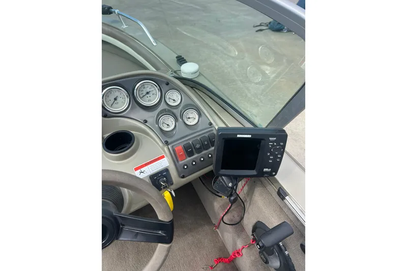 Slide: The Image of 2006 Lowe Fish & Ski 175 dashboard with gauges and fish finder. - 17