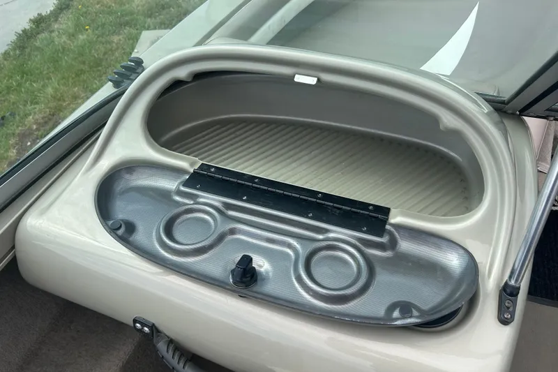 Slide: The Image of Open storage compartment on a 2006 Lowe Fish & Ski 175 boat. - 18