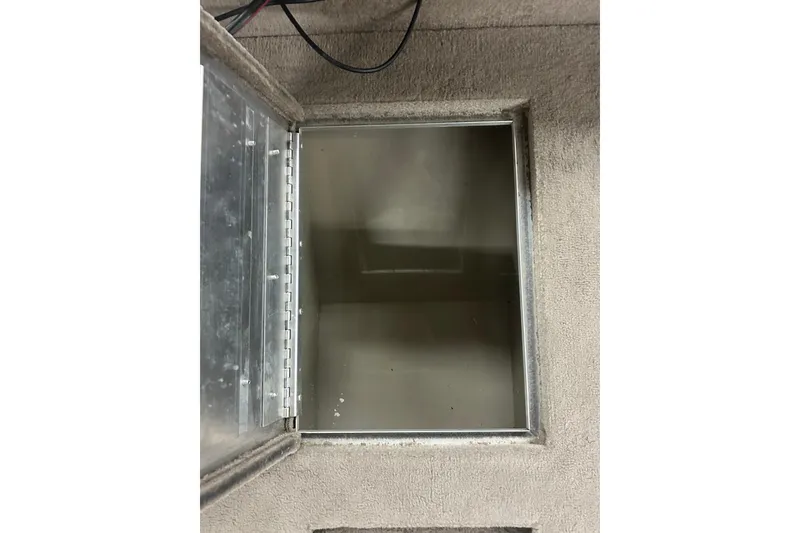 Slide: The Image of Open storage compartment on 2006 Lowe Fish & Ski 175 boat, showing interior details. - 29