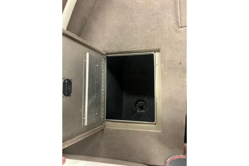 Slide: The Image of Open storage compartment on 2006 Lowe Fish & Ski 175 boat. - 31